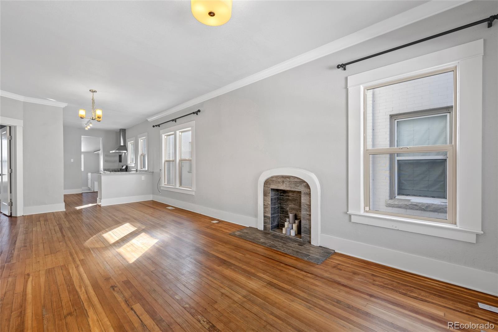 3340 Decatur Street Denver, CO 80211 - Photo 3 of 29 a view of empty room with wooden floor and fan