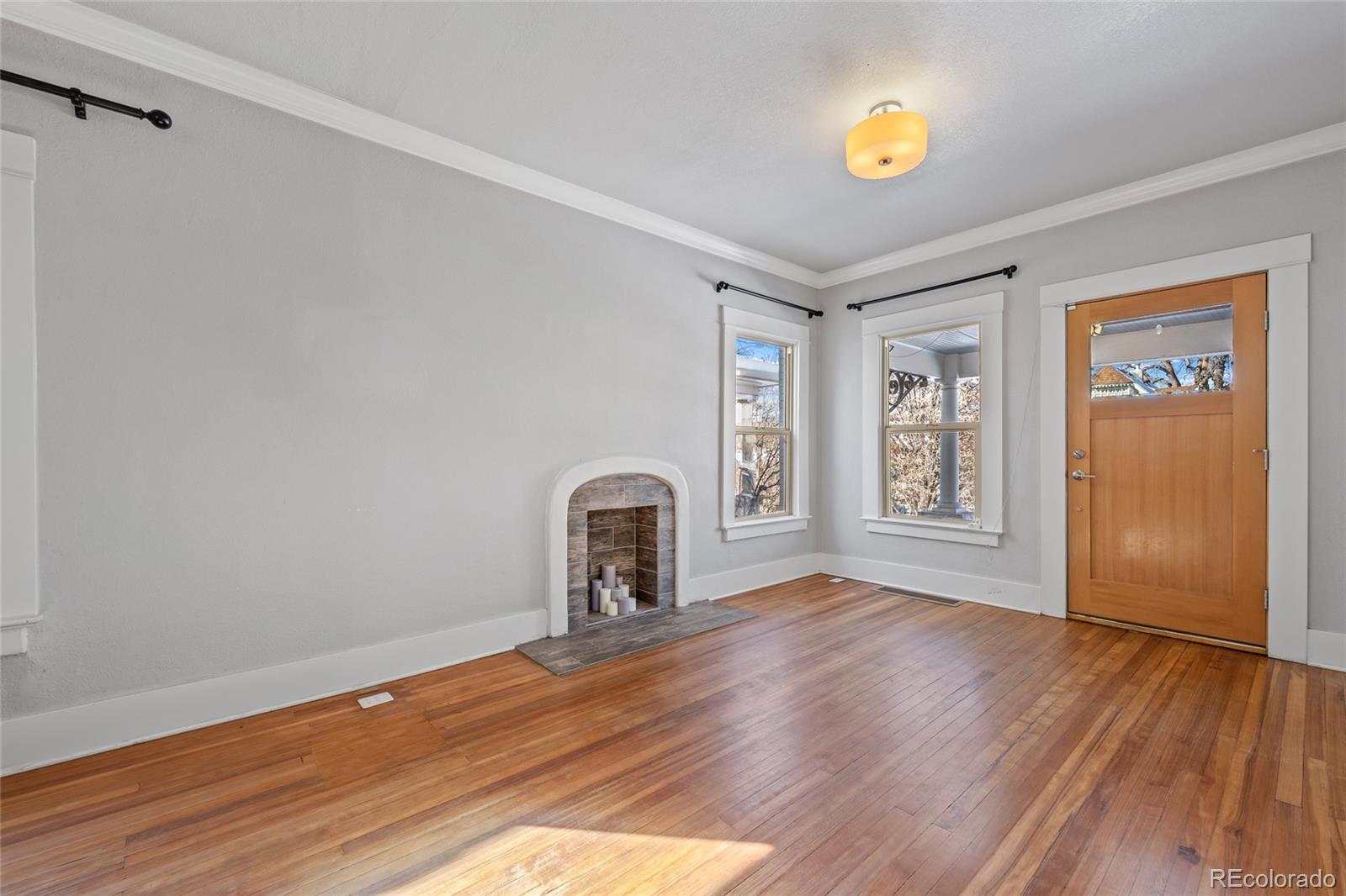 3340 Decatur Street Denver, CO 80211 - Photo 4 of 29 a view of a livingroom with wooden floor and a window