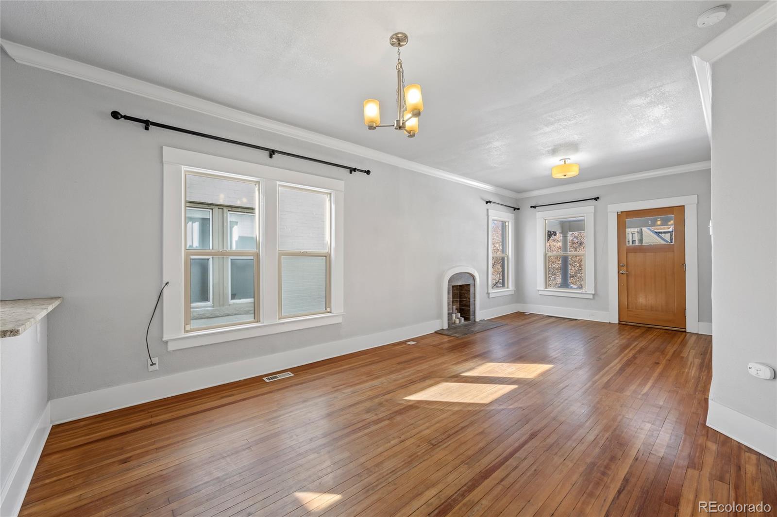 3340 Decatur Street Denver, CO 80211 - Photo 5 of 29 a view of empty room with wooden floor and fan