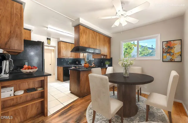 a view of a bedroom with a bed and a chandelier fan
