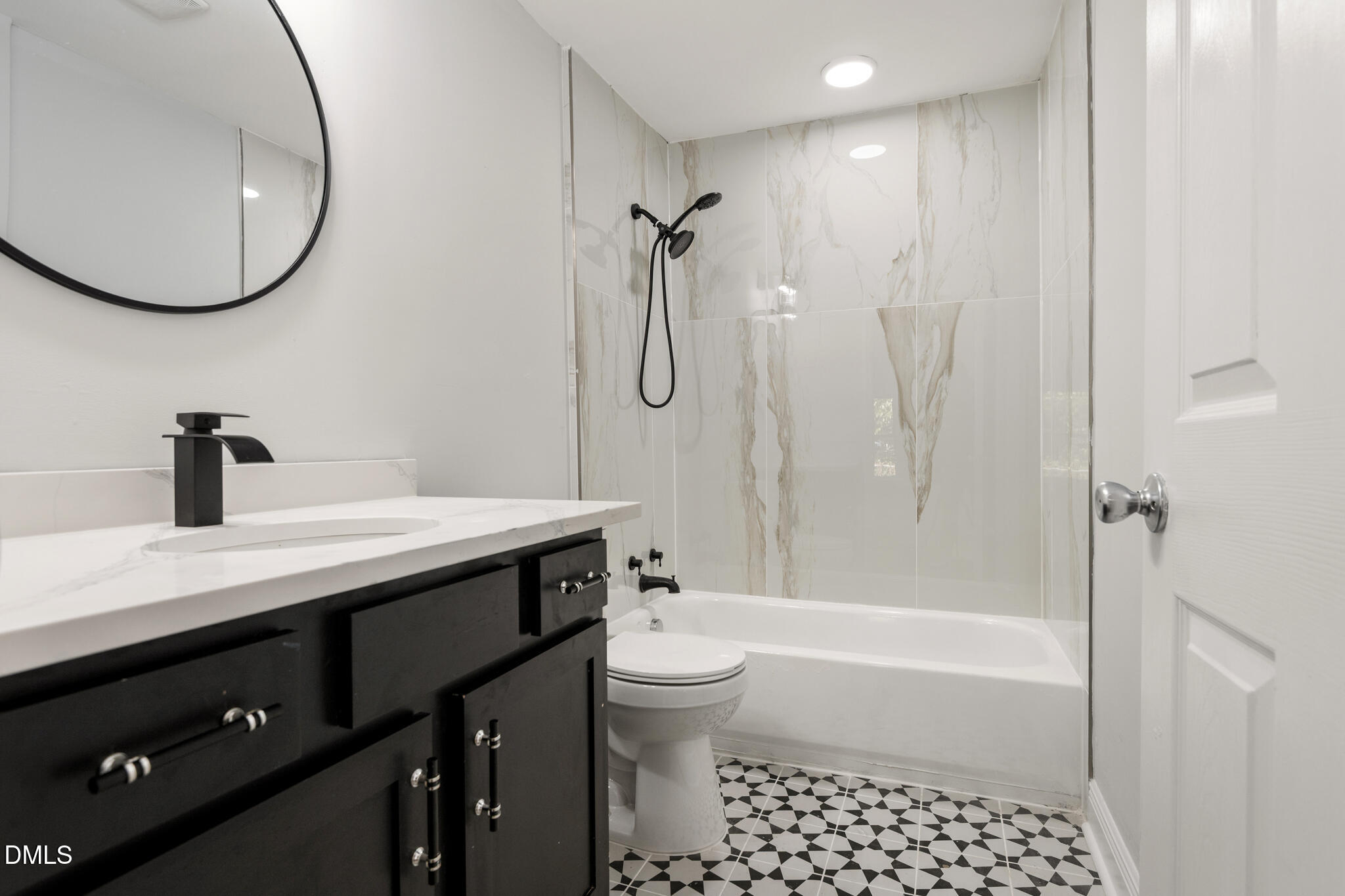 2705 Broad Street Durham, NC 27704 - Photo 20 of 33 a bathroom with a sink a toilet and a mirror