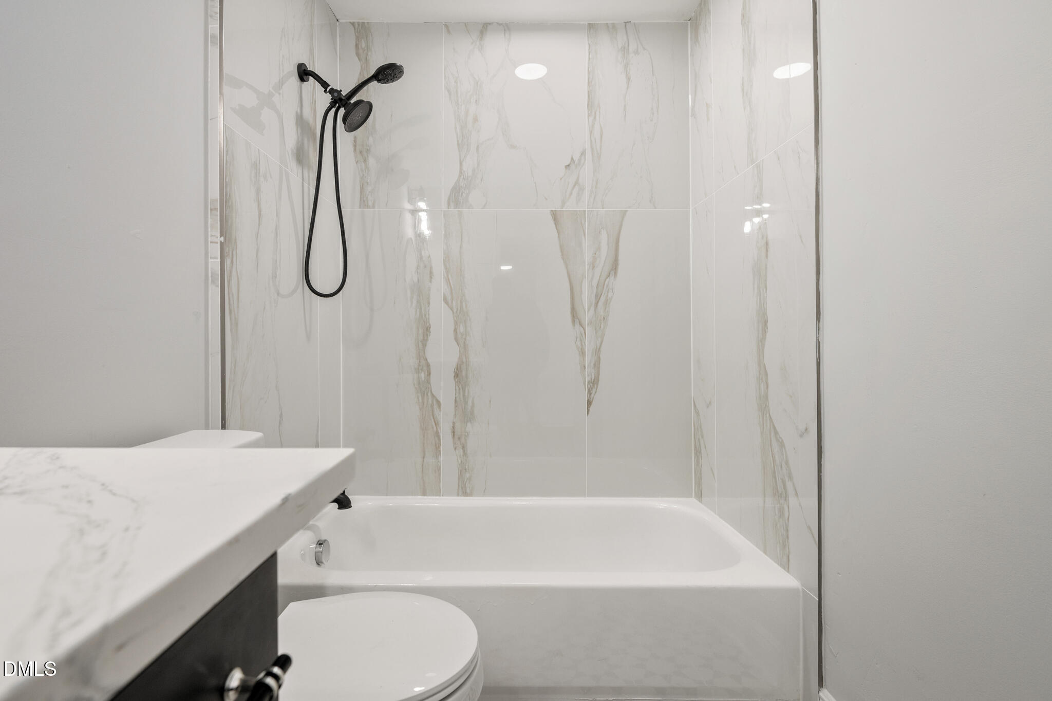 2705 Broad Street Durham, NC 27704 - Photo 21 of 33 a bathroom with a sink a toilet and a bathtub