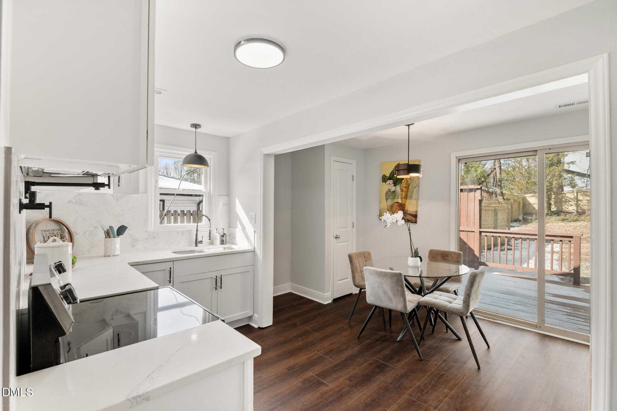 2705 Broad Street Durham, NC 27704 - Photo 24 of 33 a view of a dining room with furniture and wooden floor