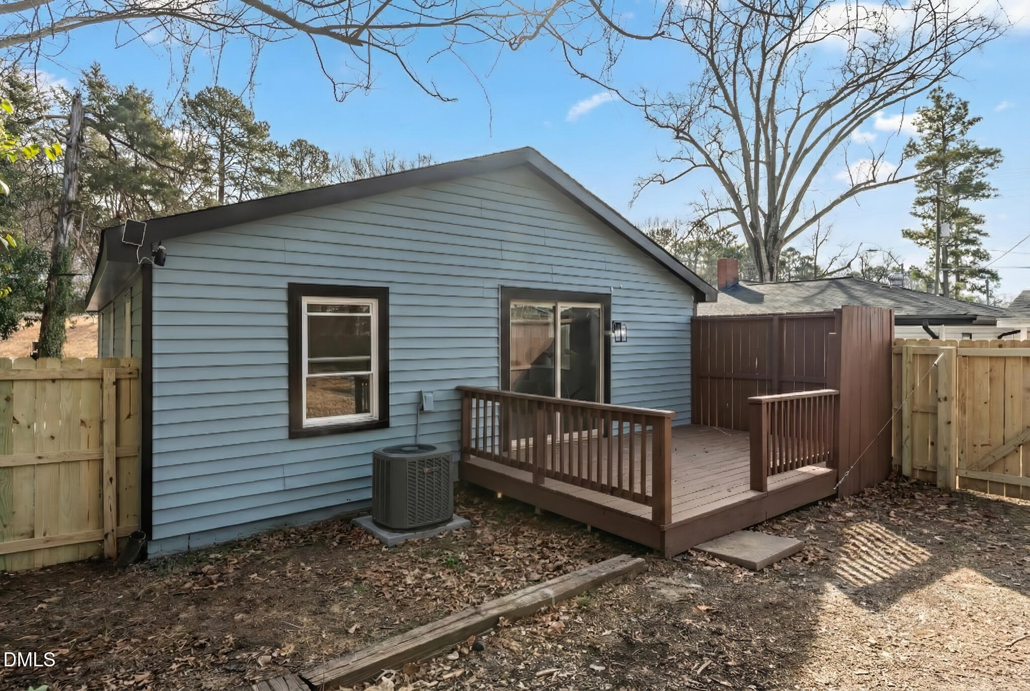 2705 Broad Street Durham, NC 27704 - Photo 31 of 33 a view of a house with a yard and wooden fence