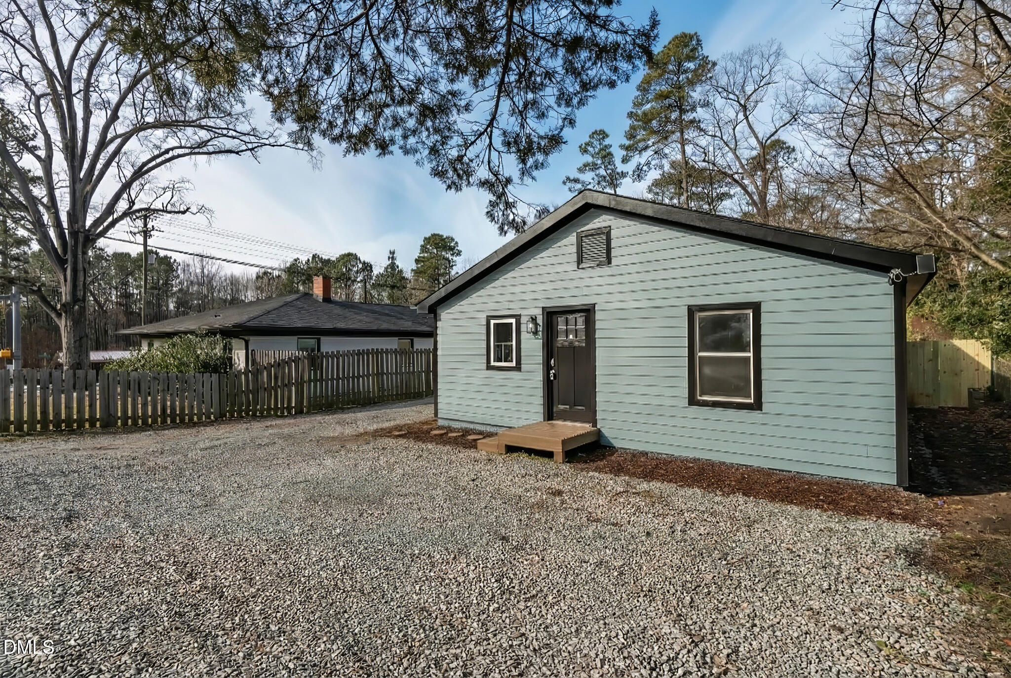 2705 Broad Street Durham, NC 27704 - Photo 6 of 33 a backyard of a house with large trees and barbeque oven