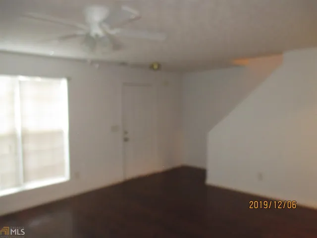 a kitchen with a sink and a refrigerator