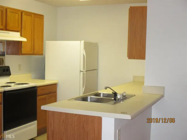 a kitchen with a sink and a window