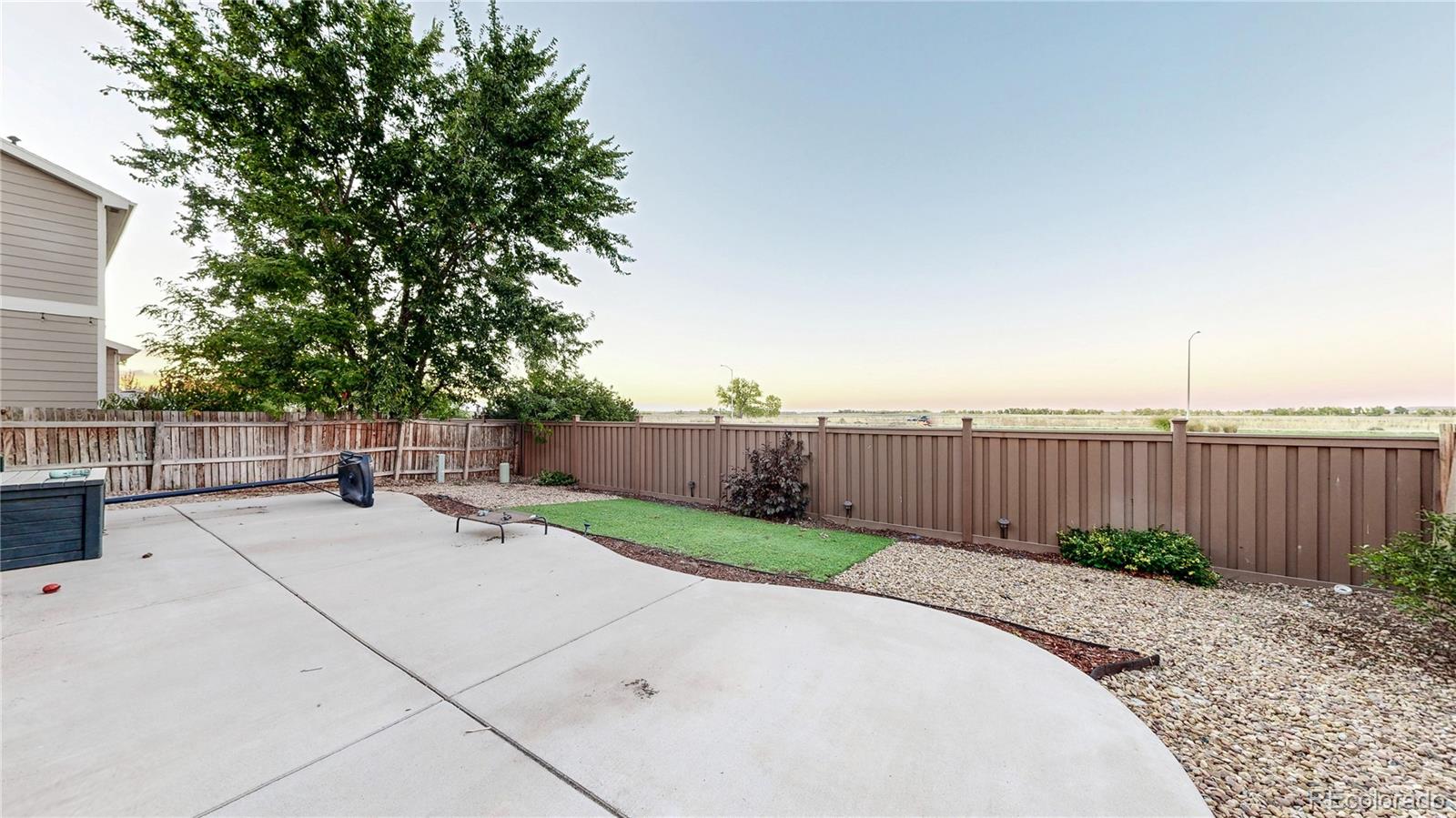 16159 Randolph Place Denver, CO 80239 - Photo 24 of 37 a view of a backyard with wooden fence