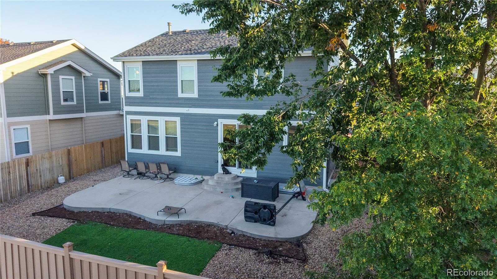 16159 Randolph Place Denver, CO 80239 - Photo 31 of 37 a view of a house with backyard and sitting area