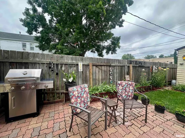 a view of a chairs and table in a patio