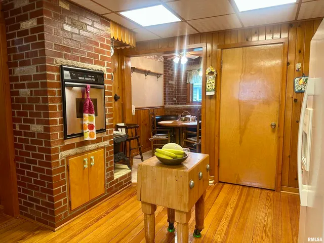 a bathroom with a granite countertop shower a sink and a mirror
