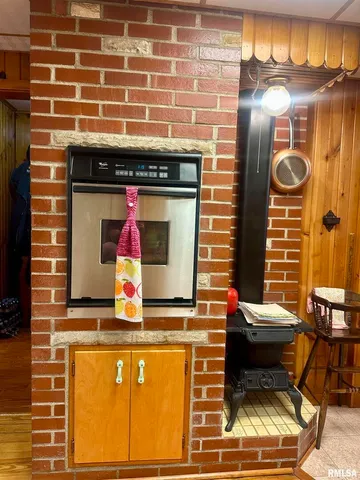 a brick building with a bench and a table