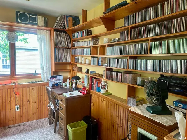 a view of a workspace with furniture