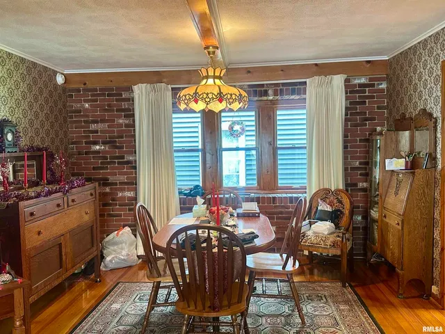 a living room with furniture a flat screen tv and floor to ceiling window