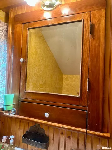 a room with a bed and furniture