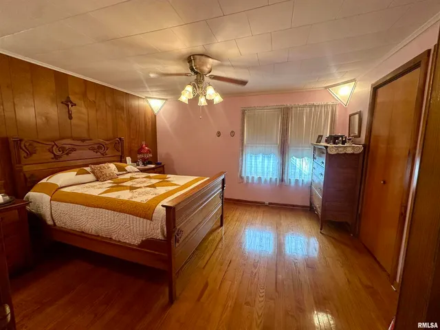 a room with a chandelier furniture and a window