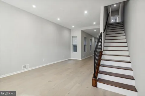 an entryway in a hall with a front door