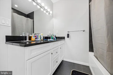 a kitchen with a sink and a refrigerator