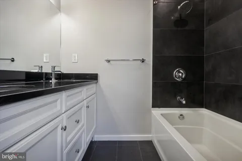 a bathroom with a bathtub and a sink