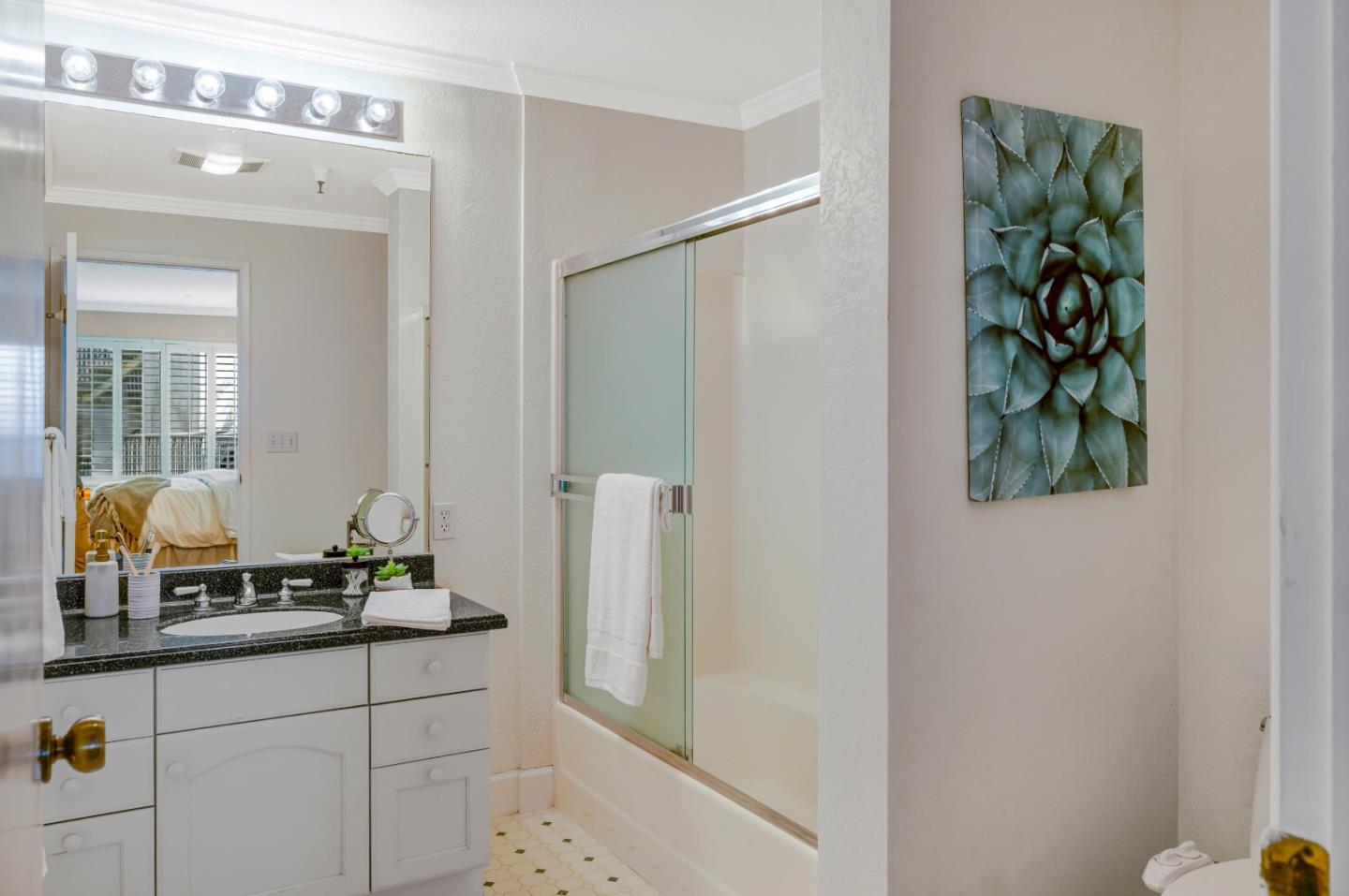 16 Shepherds Knoll Road Monterey, CA 93940 - Photo 13 of 18 a bathroom with a granite countertop sink and a mirror