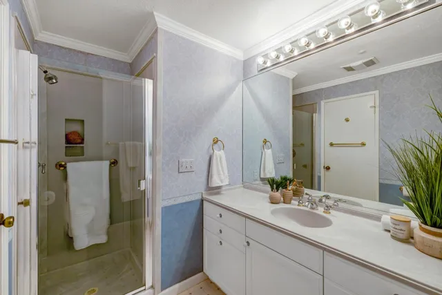 a bathroom with a double vanity sink and a mirror