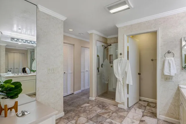 a bathroom with a shower and a sink