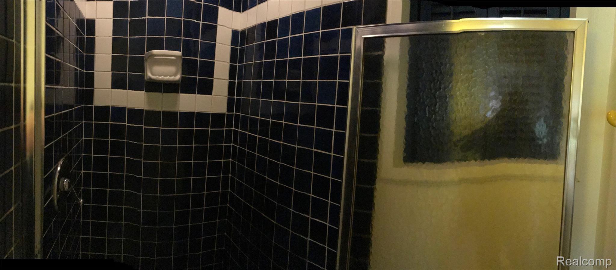 1370 East Cook Road Grand Blanc, MI 48439 - Photo 20 of 34 The 2nd Full Bath features Tiled Shower and Glass Shower Door.