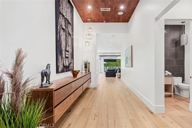 a view of living room with furniture and wooden floor