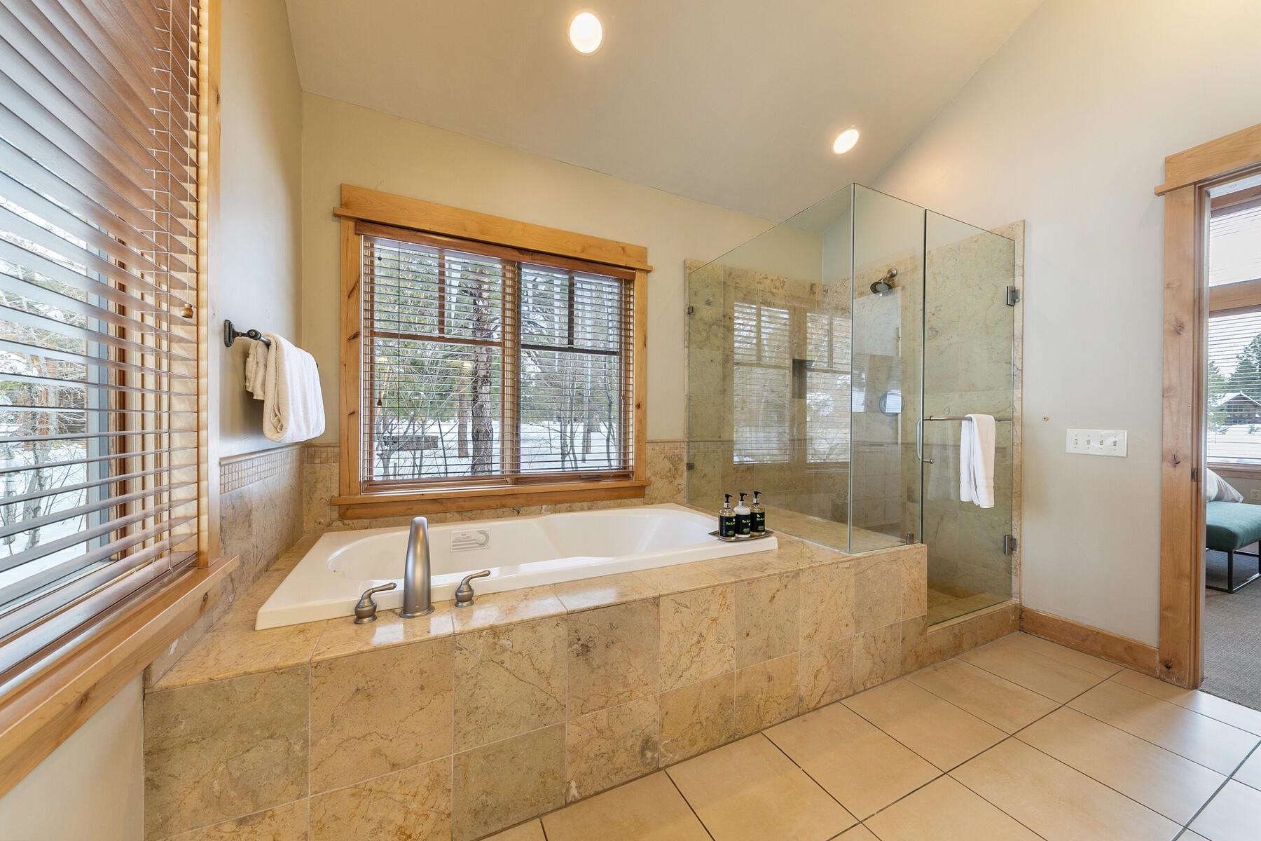12339 Lookout Loop, Unit F0638 Truckee, CA 96161 - Photo 17 of 27 a spacious bathroom with a tub sink and shower