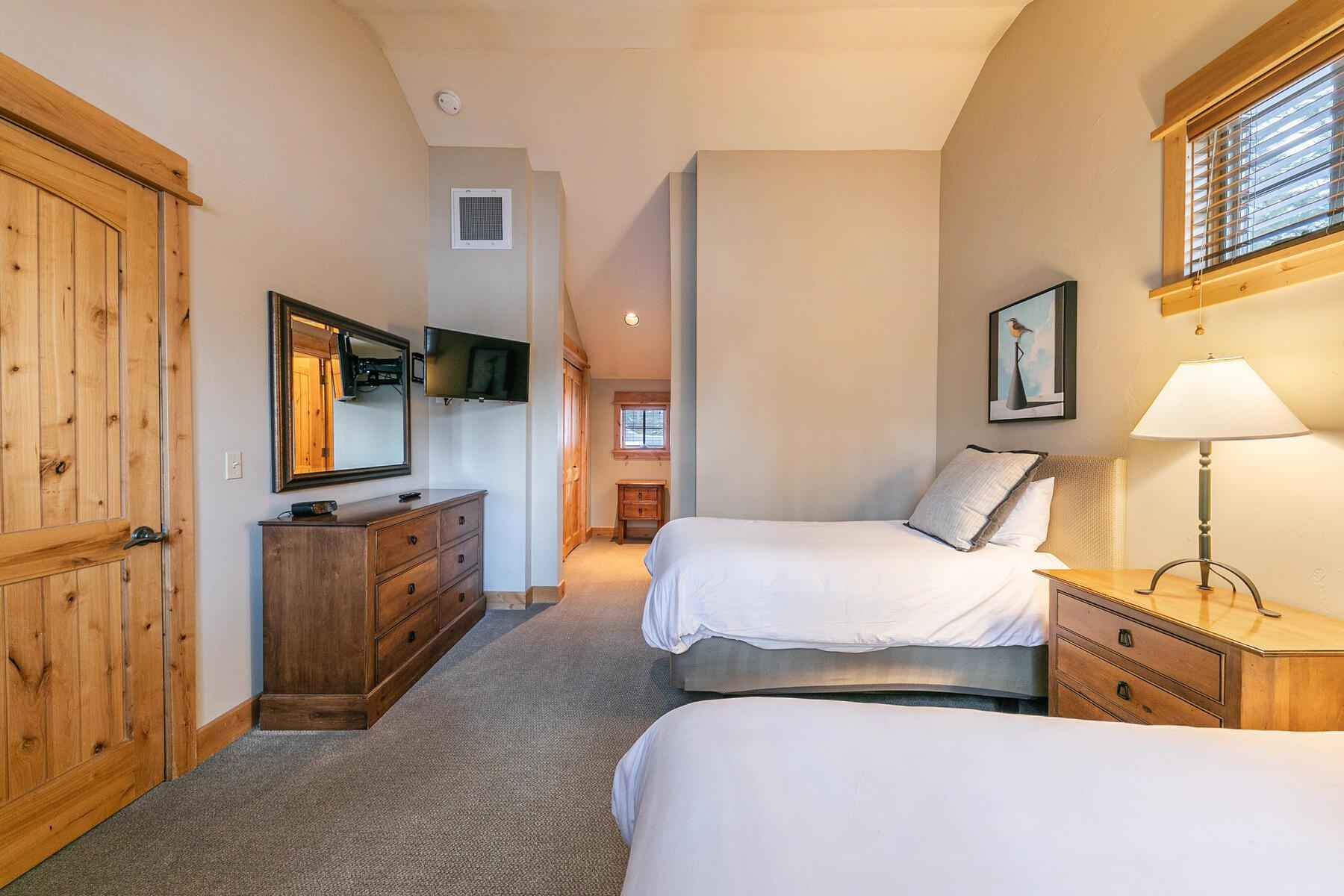 12339 Lookout Loop, Unit F0638 Truckee, CA 96161 - Photo 22 of 27 a bedroom with bed and a night stand