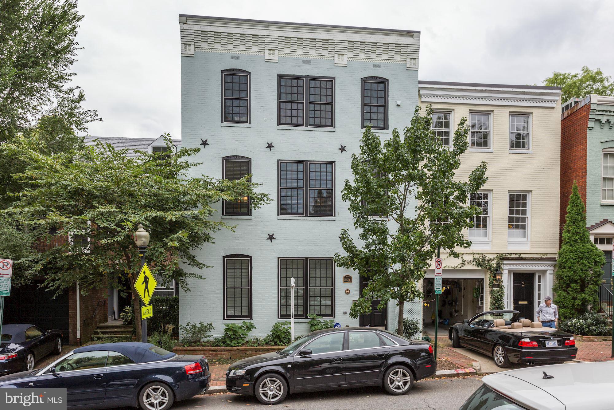 3318 Volta Place Northwest, Unit 2 Washington, DC 20007 - Photo 2 of 30 a front view of a house with parking