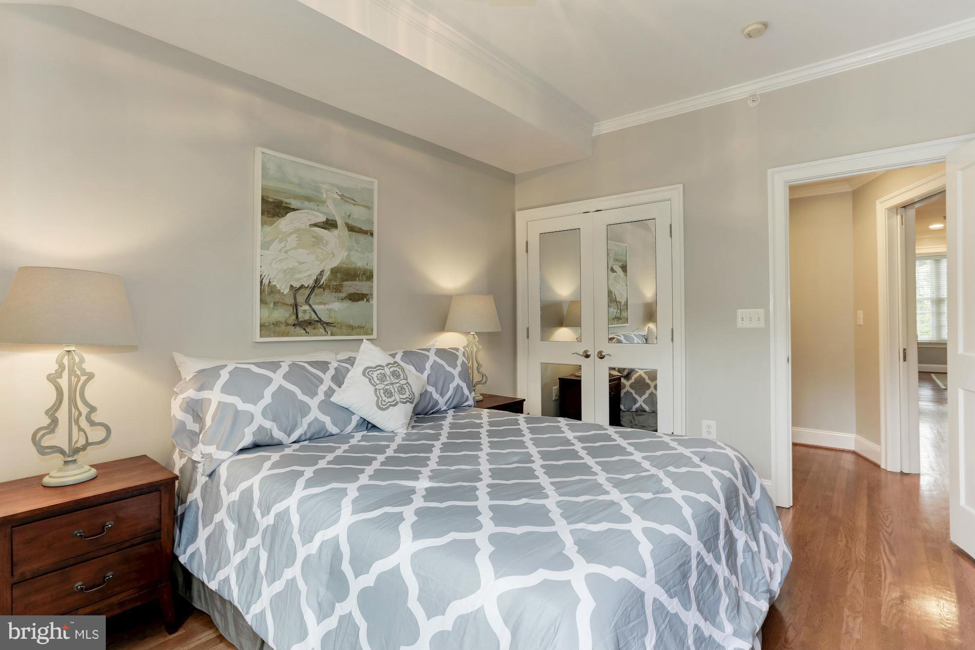 3318 Volta Place Northwest, Unit 2 Washington, DC 20007 - Photo 19 of 30 a bedroom with a large bed and painting on the wall