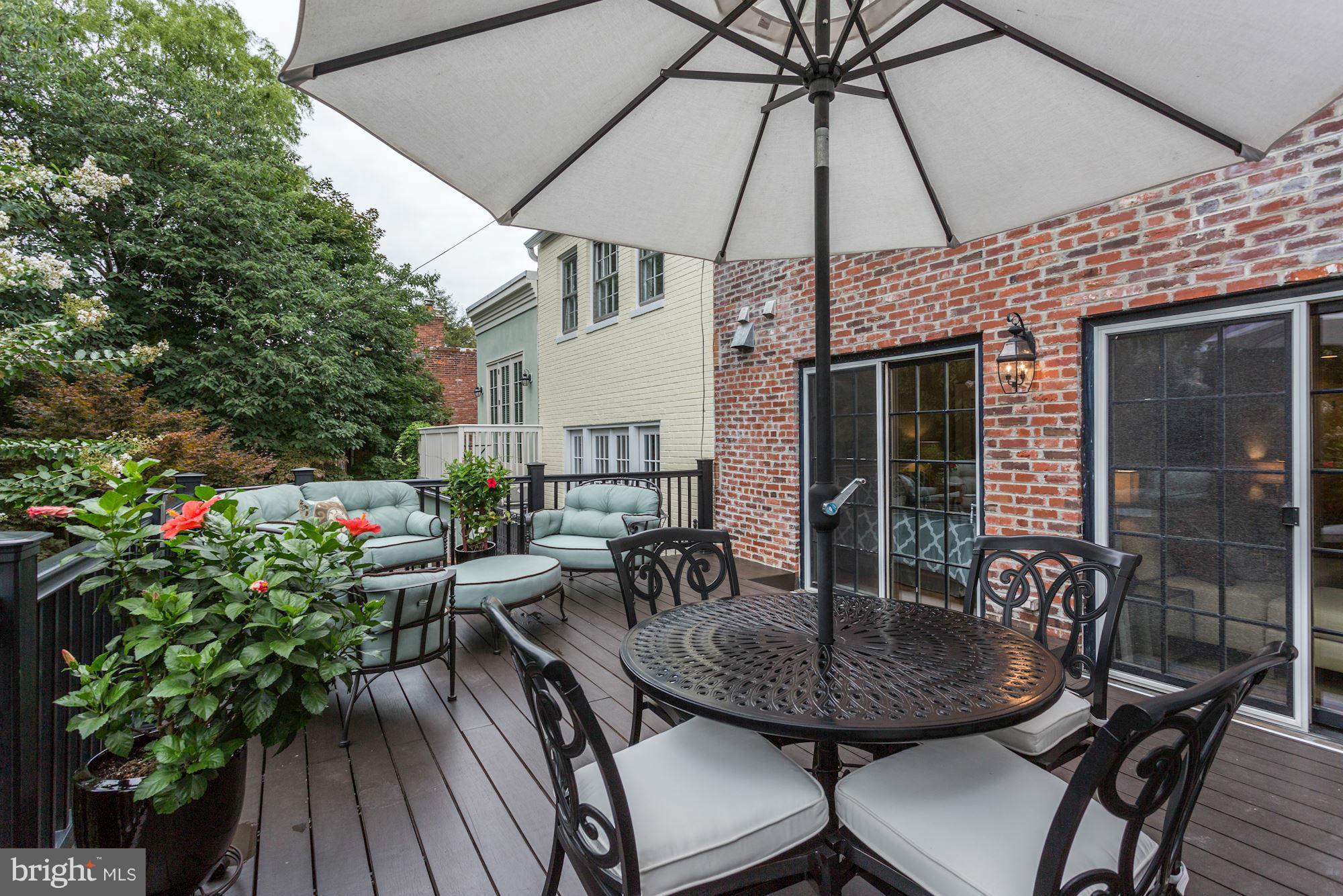 3318 Volta Place Northwest, Unit 2 Washington, DC 20007 - Photo 29 of 30 a view of a house with backyard and sitting area