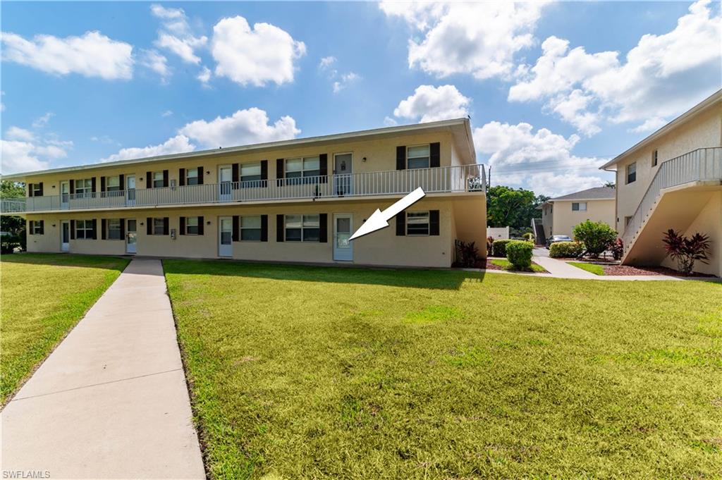 3325 Airport Road North, Unit T1 Naples, FL 34105 - Photo 1 of 19 a view of swimming pool with lawn chairs and plants