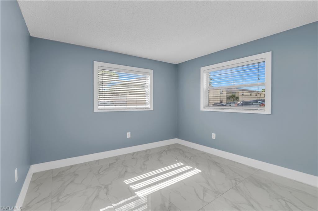 3325 Airport Road North, Unit T1 Naples, FL 34105 - Photo 14 of 19 a view of a room with a large window