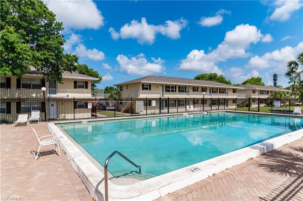 3325 Airport Road North, Unit T1 Naples, FL 34105 - Photo 18 of 19 a view of a house with pool