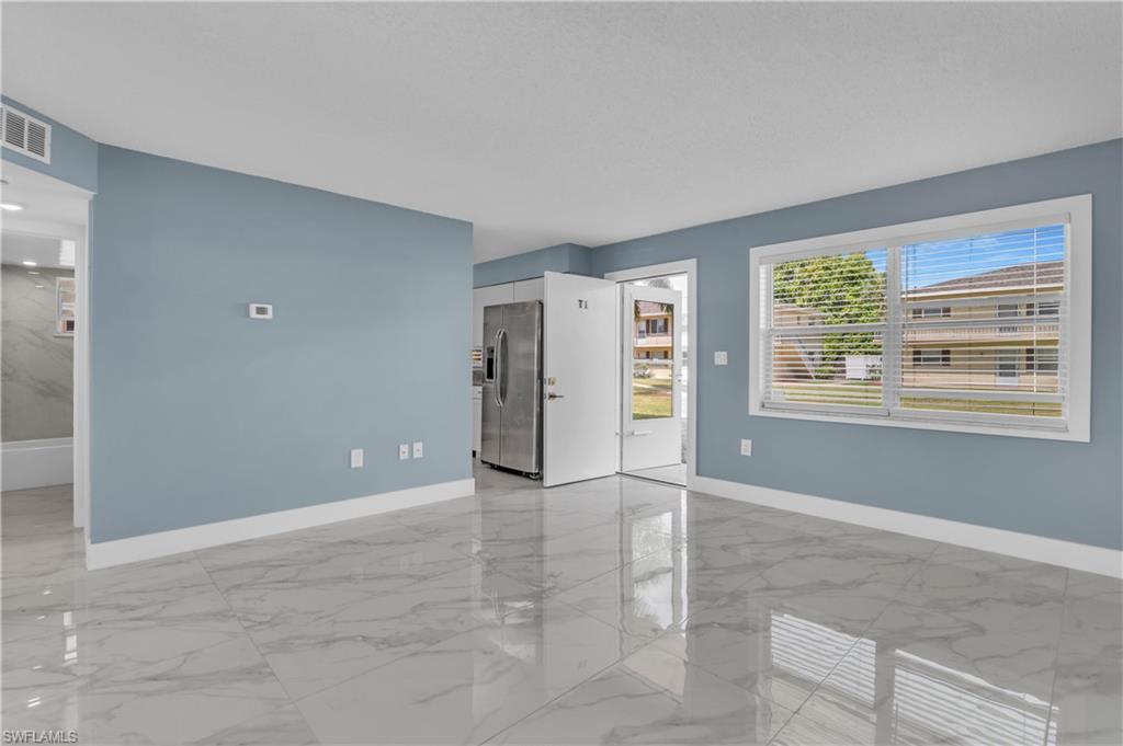 3325 Airport Road North, Unit T1 Naples, FL 34105 - Photo 5 of 19 a view of an empty room with a window