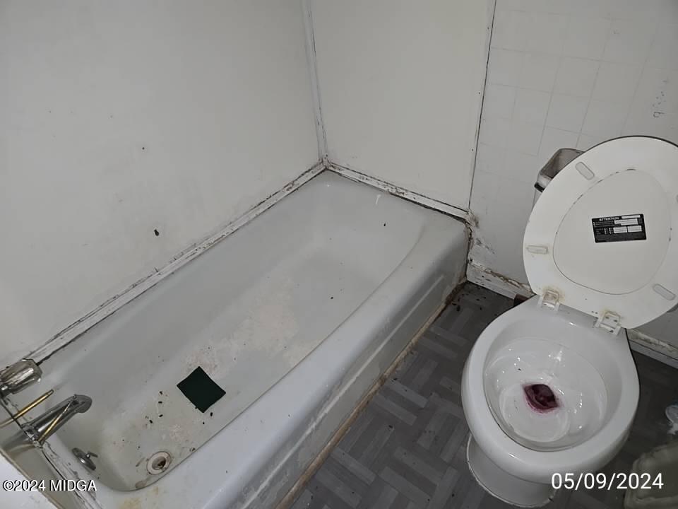 1627 Upper River Road Macon, GA 31211 - Photo 11 of 23 a bathroom with a toilet and a sink