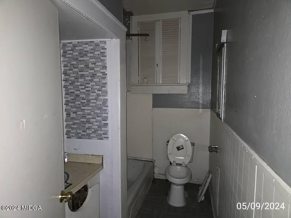 1627 Upper River Road Macon, GA 31211 - Photo 13 of 23 a bathroom with a toilet and a shower