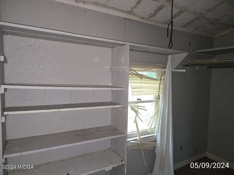 1627 Upper River Road Macon, GA 31211 - Photo 14 of 23 a view of walk in closet with window
