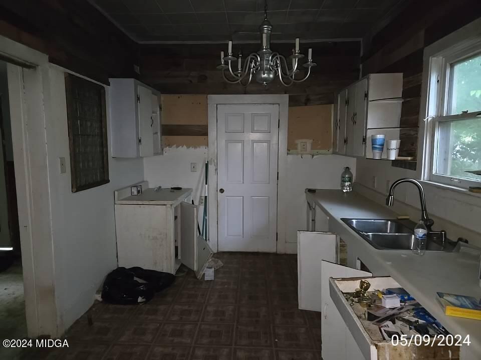 1627 Upper River Road Macon, GA 31211 - Photo 18 of 23 a kitchen with refrigerator and cabinets