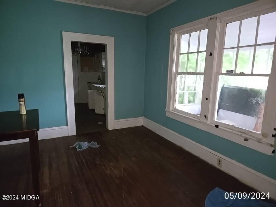 1627 Upper River Road Macon, GA 31211 - Photo 19 of 23 an empty room with wooden floor and windows
