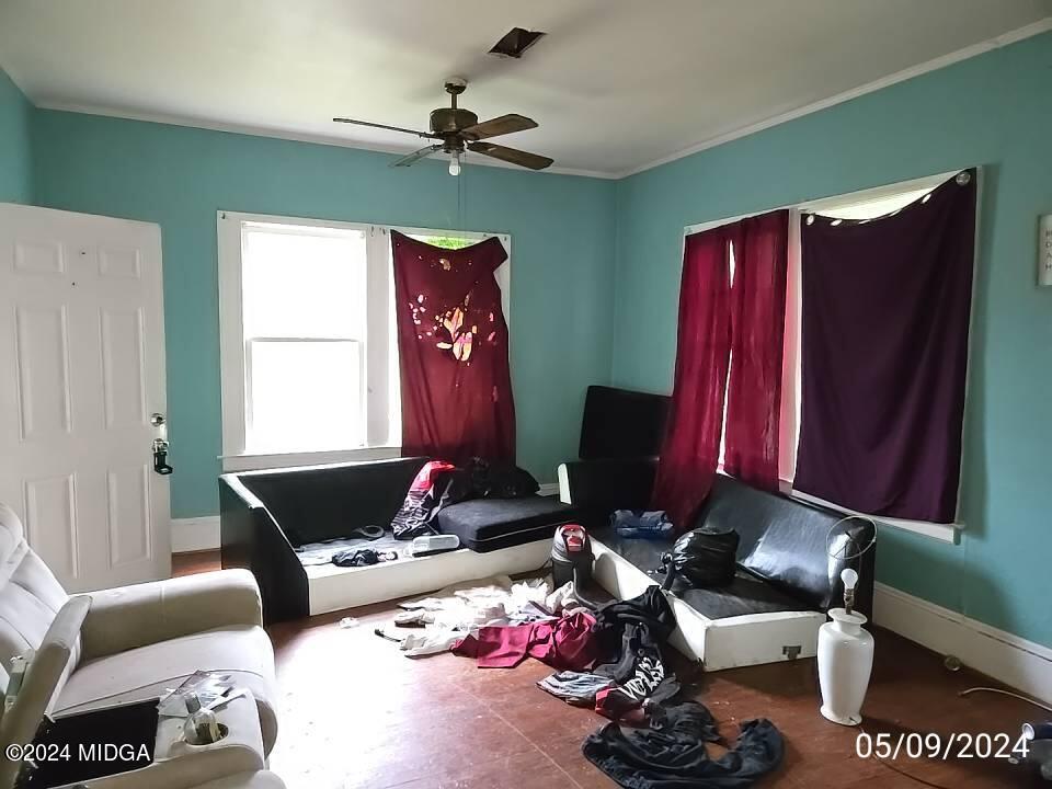 1627 Upper River Road Macon, GA 31211 - Photo 20 of 23 a living room with furniture a lamp and a window