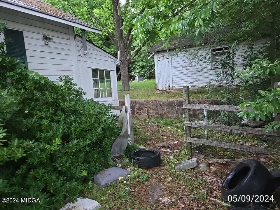 1627 Upper River Road Macon, GA 31211 - Photo 8 of 23 a view of a backyard with plants