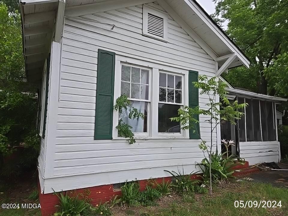 1627 Upper River Road Macon, GA 31211 - Photo 10 of 23 a front view of a house with garden