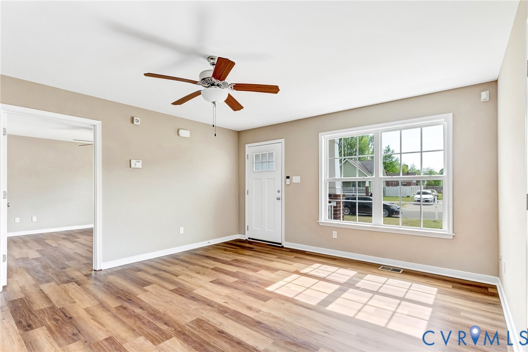 9925 Reymet Court Richmond, VA 23237 - Photo 5 of 30 a view of empty room with wooden floor and fan