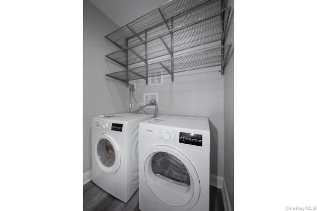 a utility room with dryer and washer