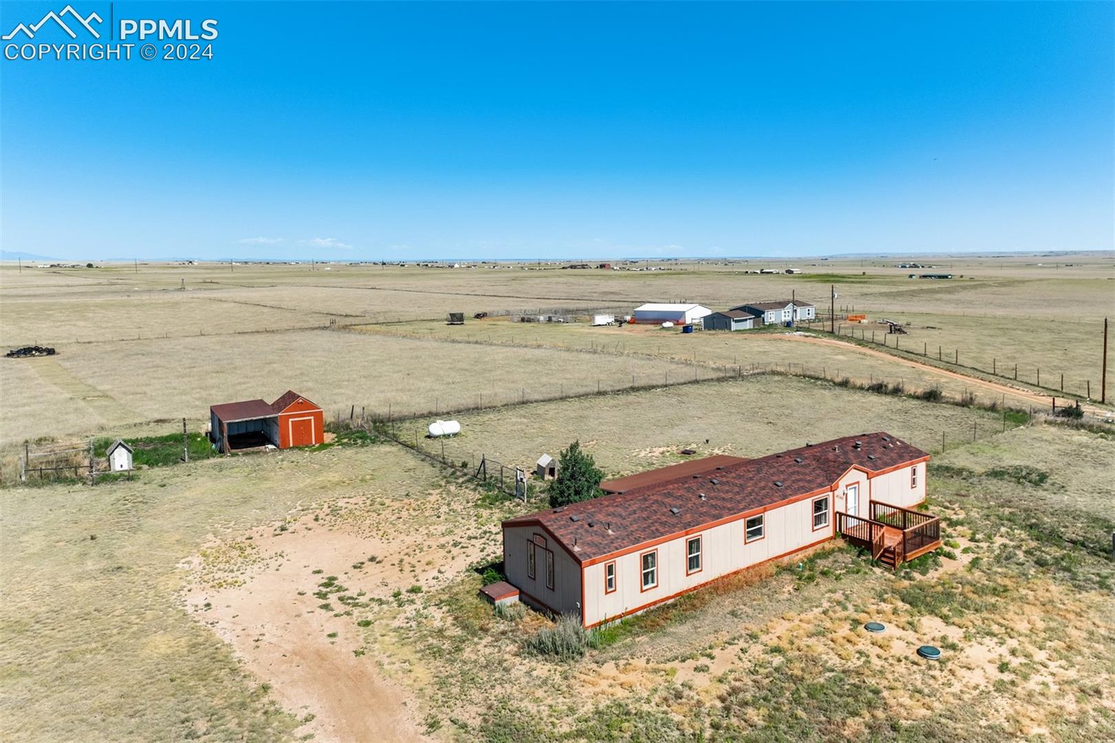 6240 Night Train Lane Yoder, CO 80864 - Photo 1 of 50 Drone / aerial view with a rural view
