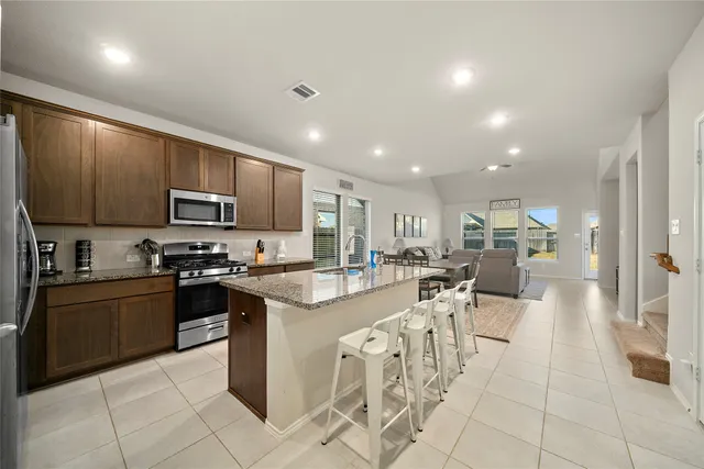 a large kitchen with cabinets