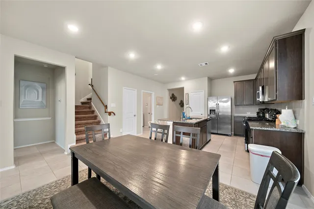 a view of kitchen with cabinets and wooden floor